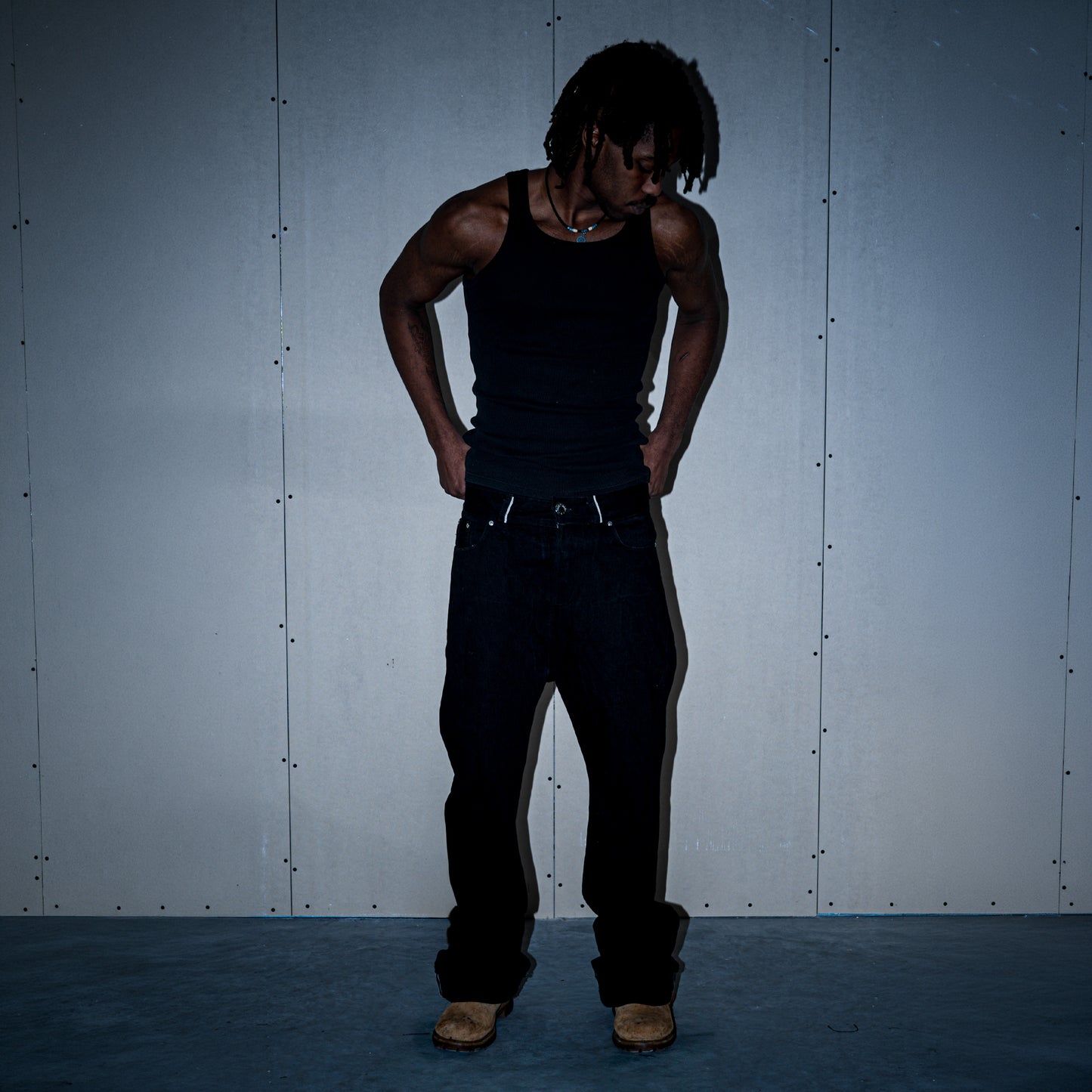 Black 1/1 flared fit selvedge denim jeans on model, front view – Reflejos Smash & Grab