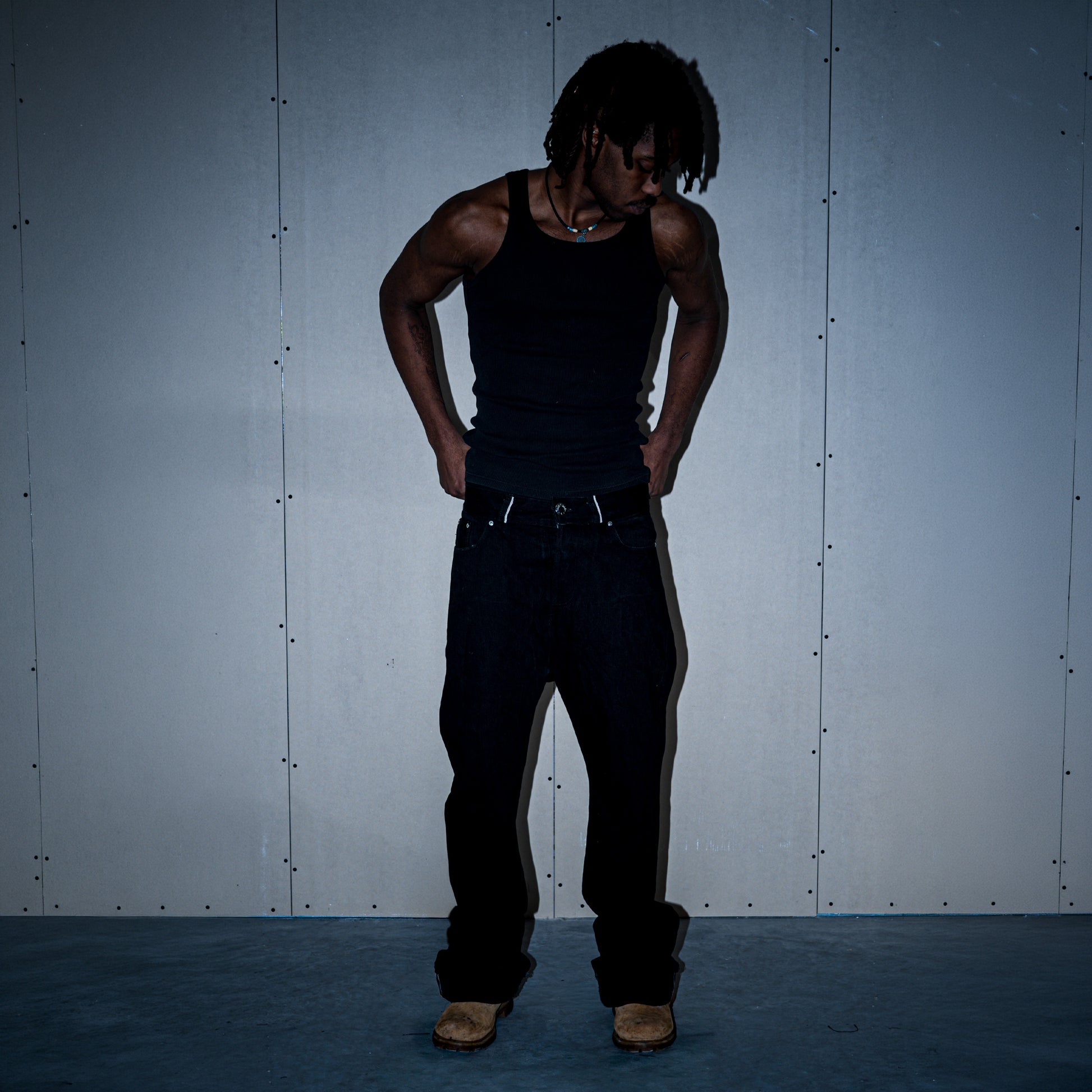Black 1/1 flared fit selvedge denim jeans on model, front view – Reflejos Smash & Grab
